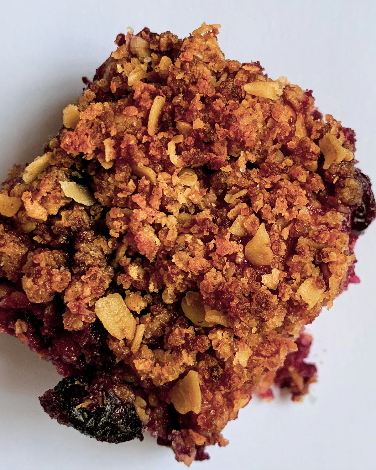 A blackberry crumble bar photographed from above
